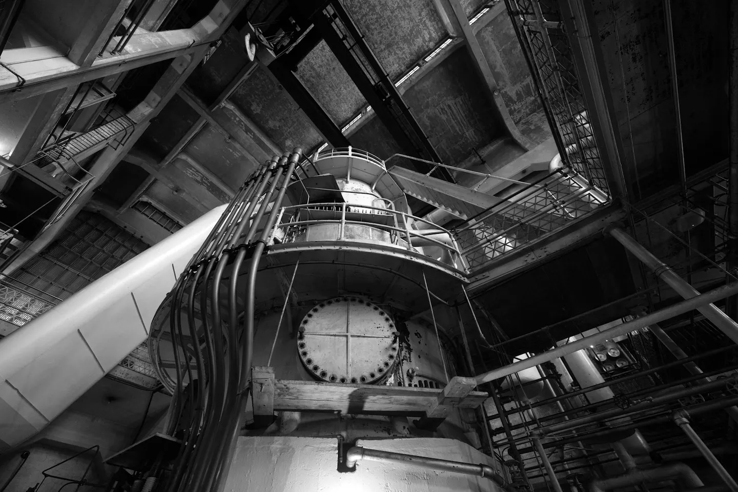 Plant room interior with large machinery and pipework, the kind of asset estate a CAFM system is meant to keep records of